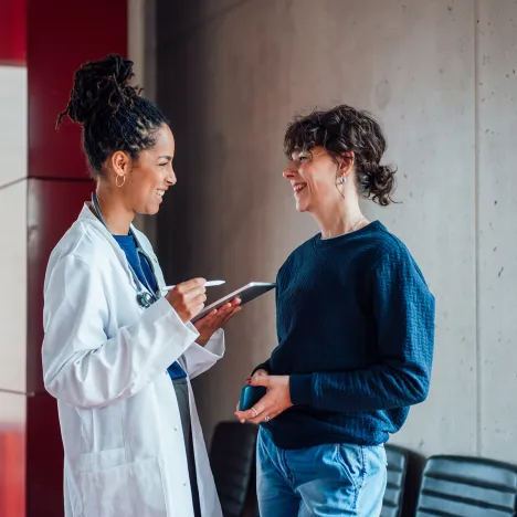 Happy-doctor-discussing-with-patient
