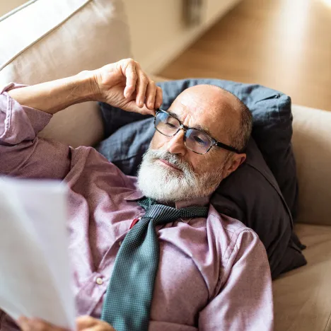 adult-male-with-glasses-reading