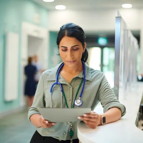 female-doctor-reading-medical-notes