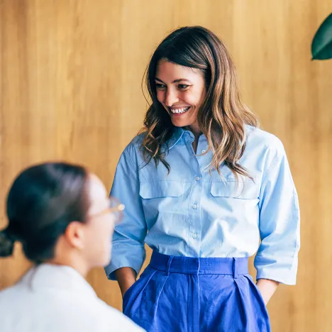 smiling-colleagues-interacting-during-a-team