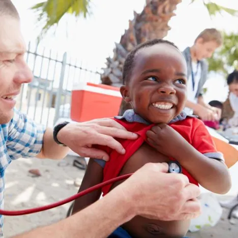 doctor treating boy